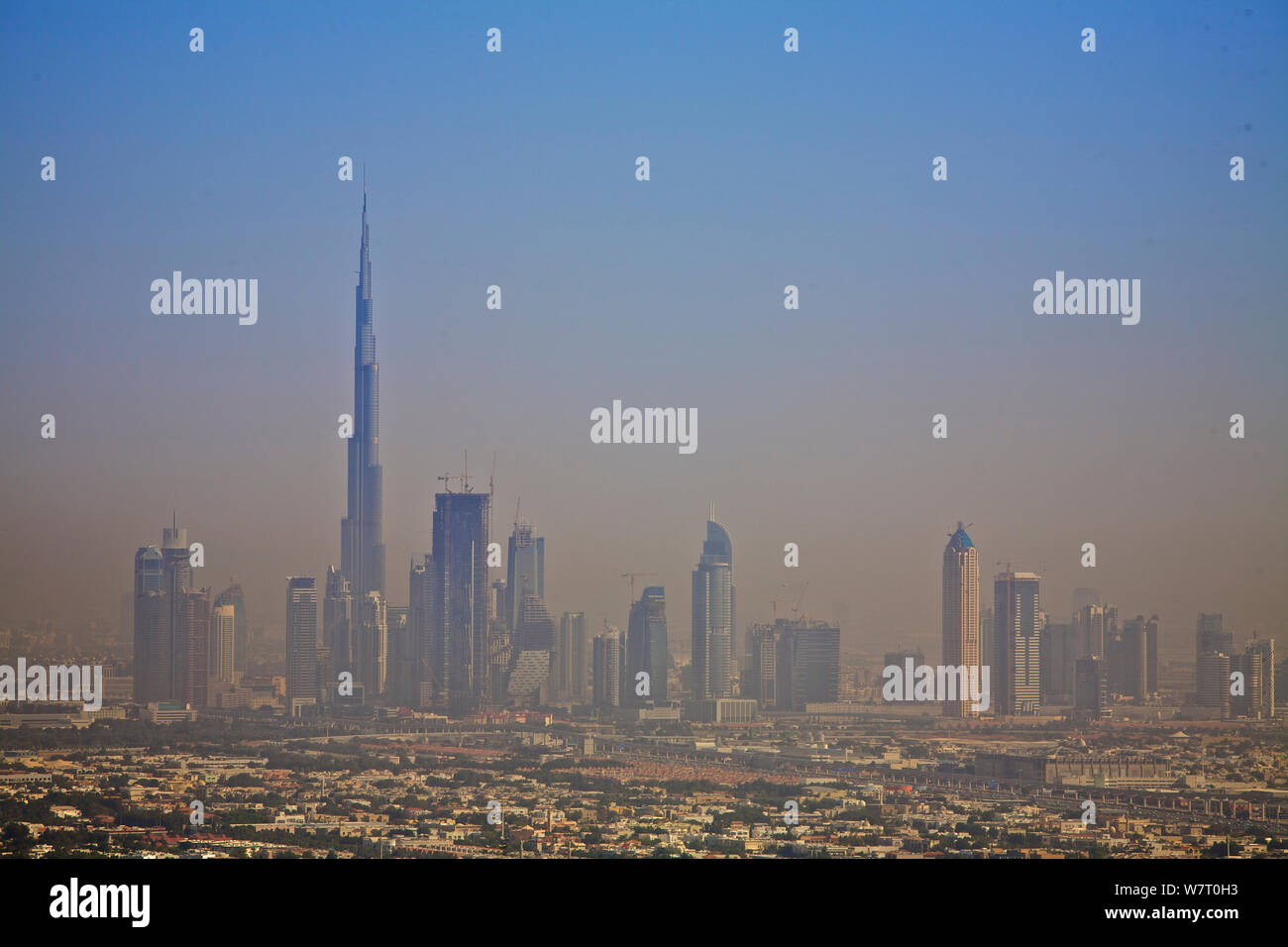 View of Dubai Skyline with Burj Kalifa - the Worlds tallest building, with smog, Dubai. United Arab Emirates, UAE, January 2010. Stock Photo