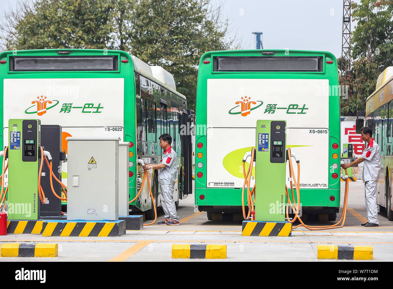 FILEChinese workers recharge electric buses at a bus charging