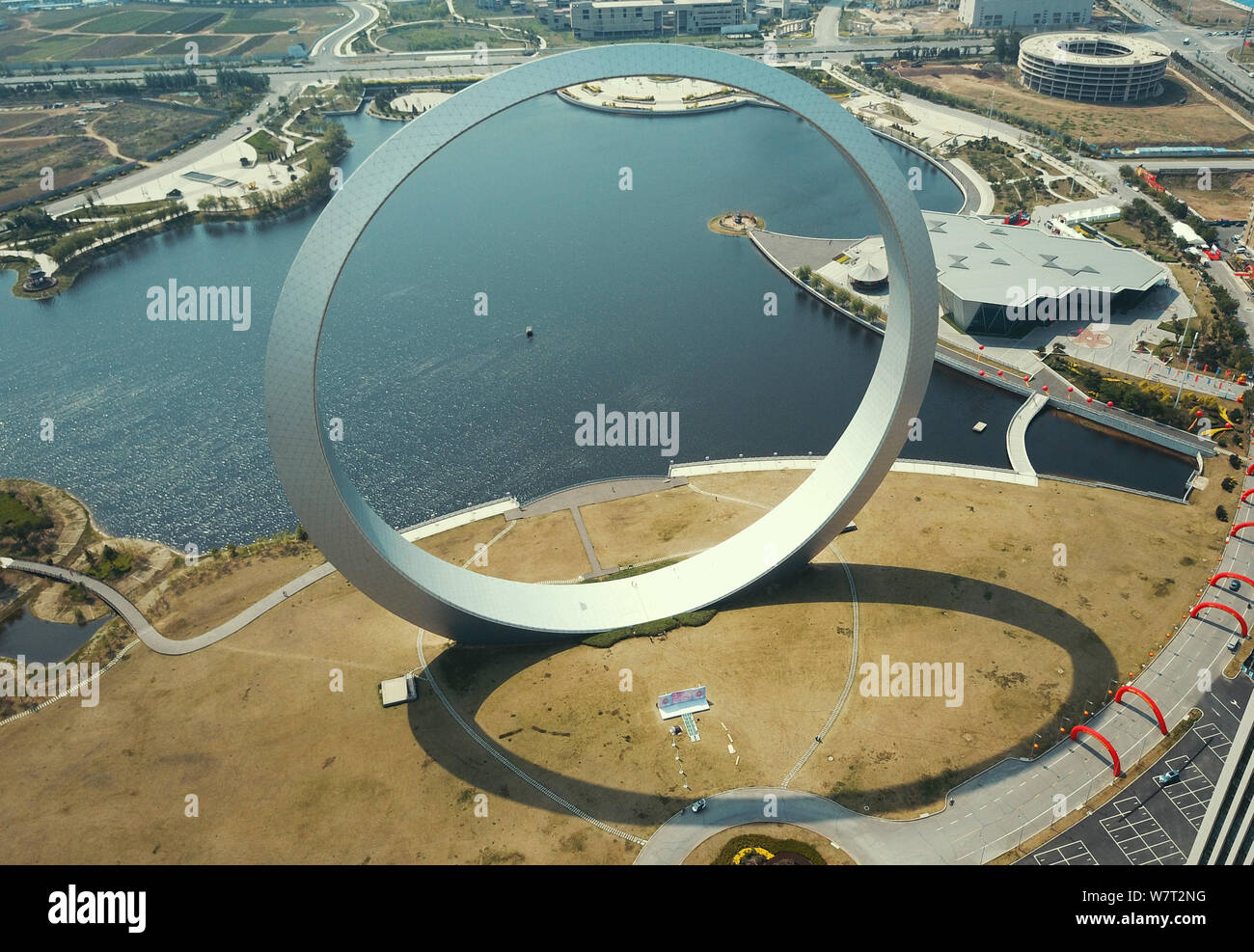 Aerial view of a gigantic steel loop dubbed the "Ring of Life" in Fushun city, northeast China's Liaoning province, 20 May 2017.   A new landmark ¨C a Stock Photo