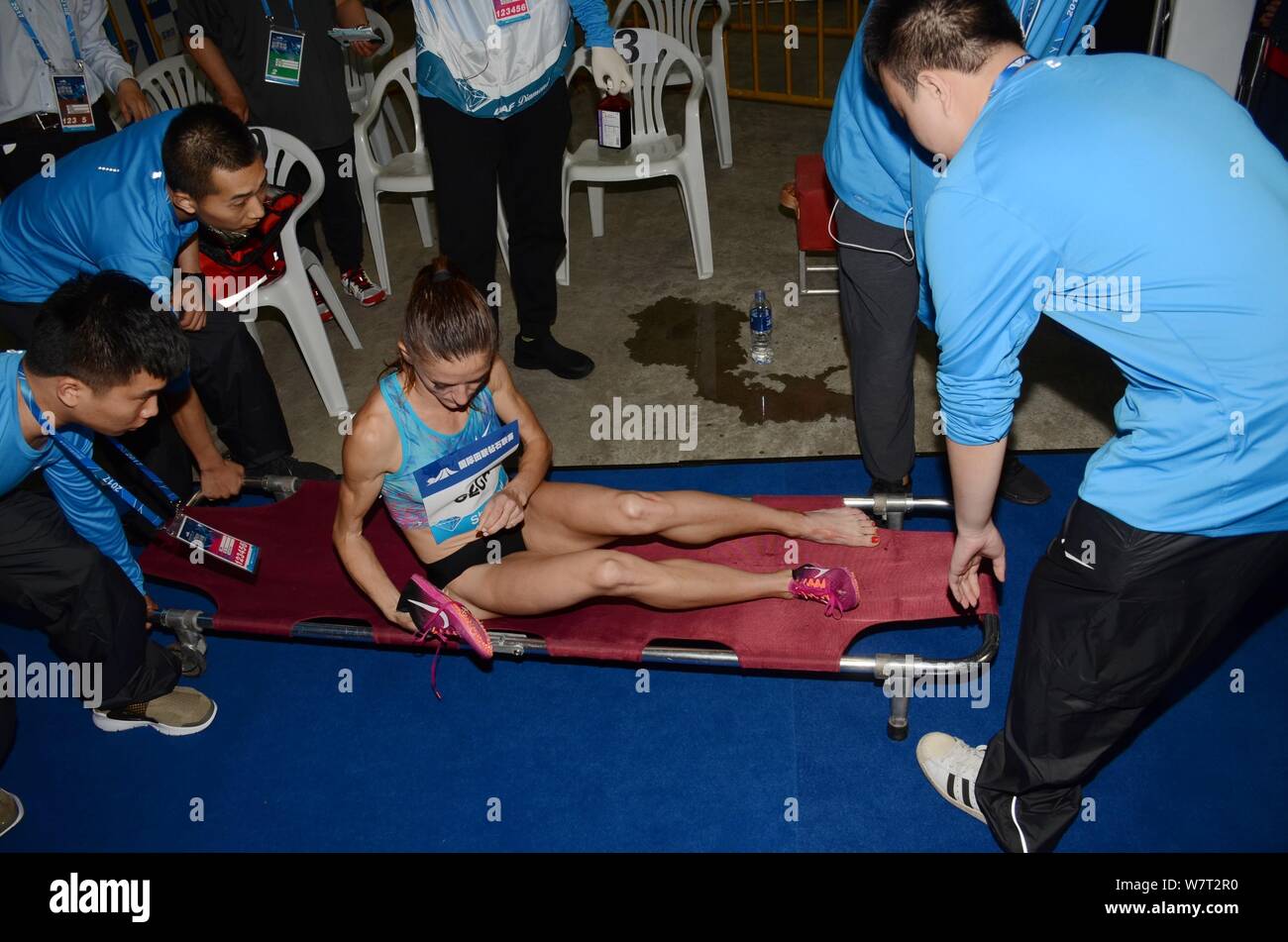 Albanian athlete Luiza Gega is carried off the stadium after injured in the the women's 3000m steeplechase during the IAAF Diamond League Shanghai 201 Stock Photo