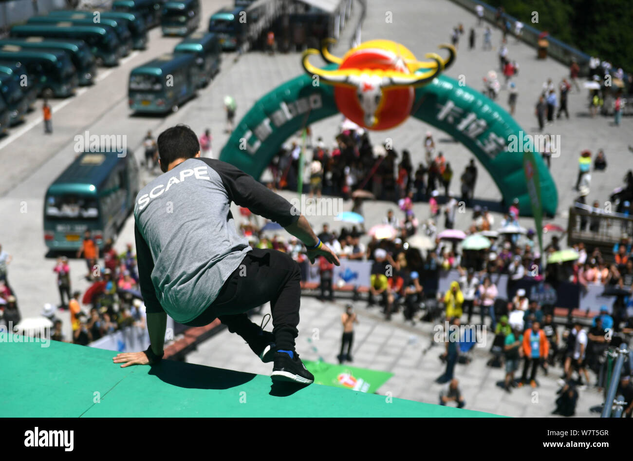 A free running athlete shows his parkour skills during the Skyladder International Freerunning Championship on the Tianmen Mountain (or Tianmenshan Mo Stock Photo