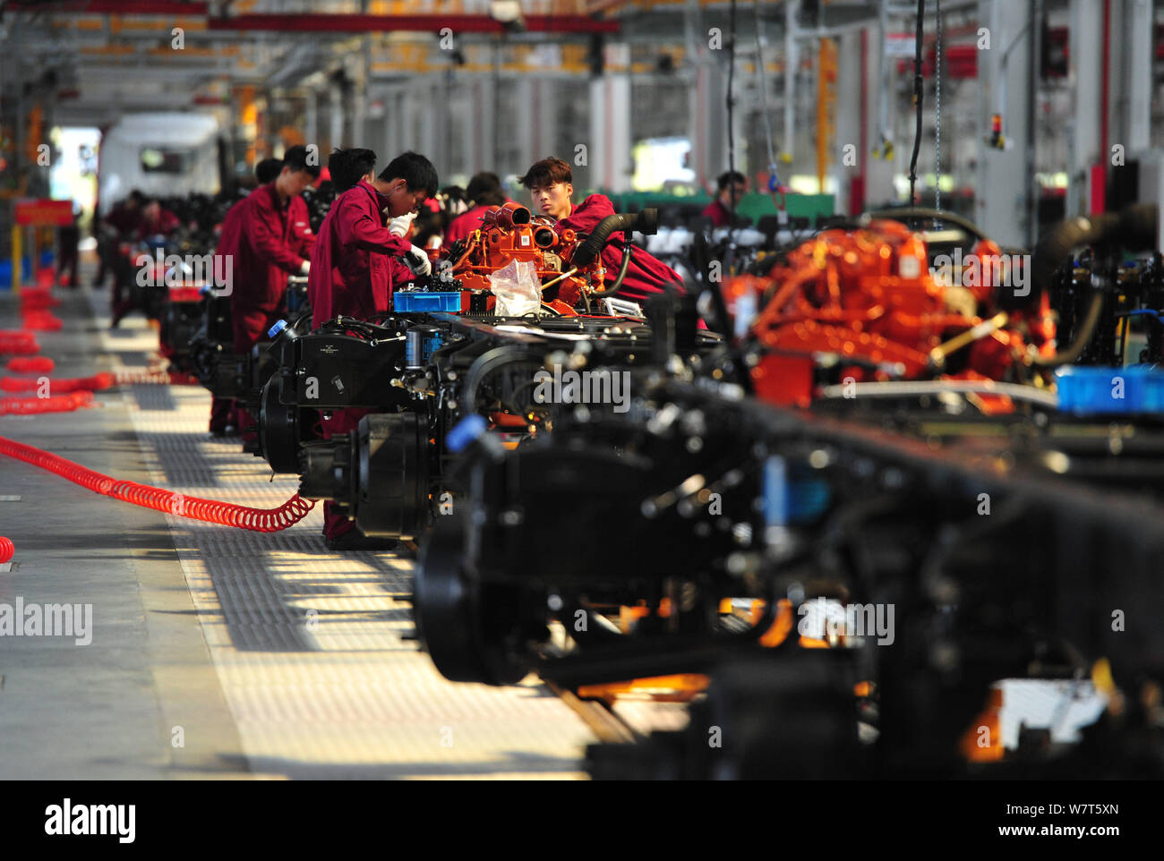--FILE--Chinese workers assemble cars on the assembly line at an auto ...