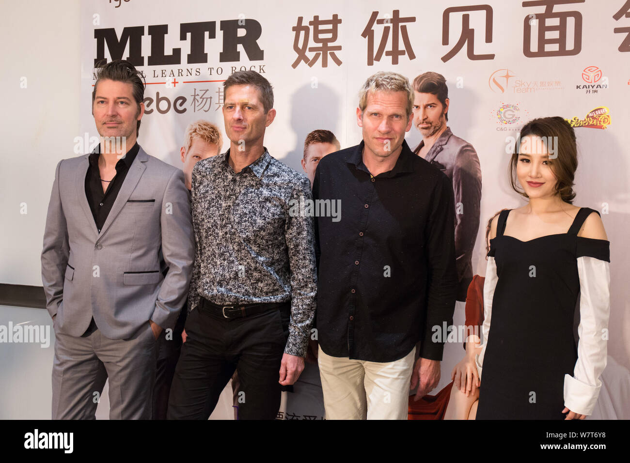 (From left) Mikkel Lentz, Kare Wanscher and Jascha Richter of Danish rock band Michael Learns to Rock (MLTR) and Chinese singer Phoebe Yang or Yang Si Stock Photo