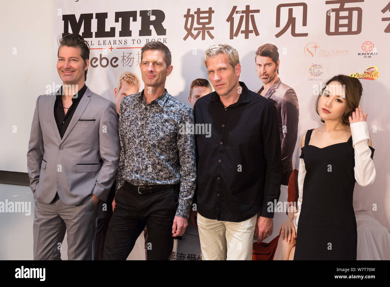 (From left) Mikkel Lentz, Kare Wanscher and Jascha Richter of Danish rock band Michael Learns to Rock (MLTR) and Chinese singer Phoebe Yang or Yang Si Stock Photo