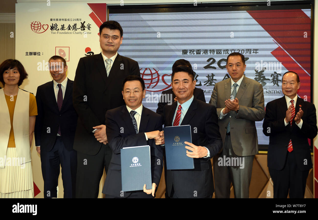 Retired Chinese basketball star Yao Ming, second left, chairman of the Chinese Basketball Association (CBA), third left, is pictured during a press co Stock Photo