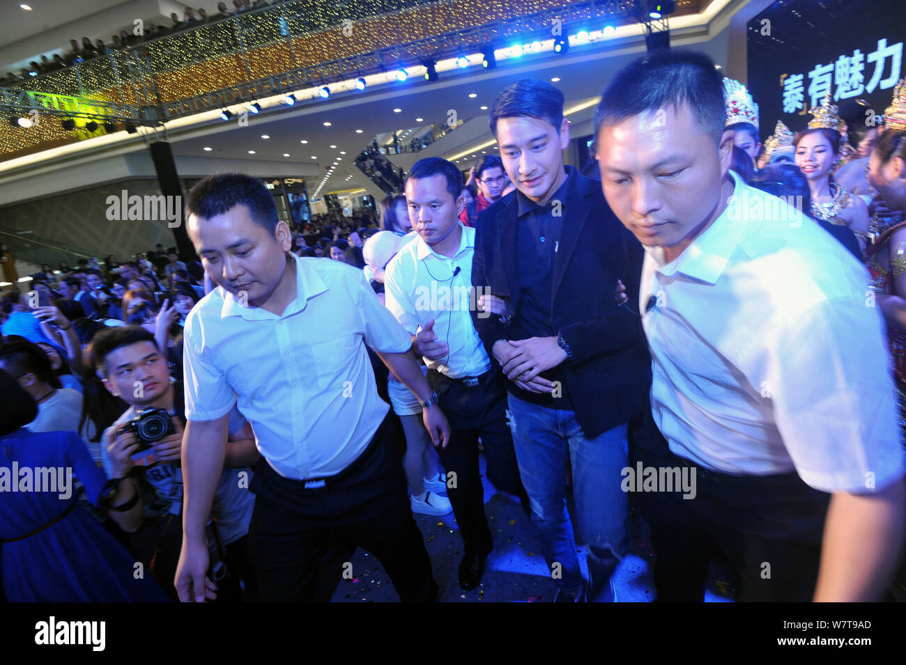 Thai actor Nawat Kulrattanarak, second right, better known by his stage
