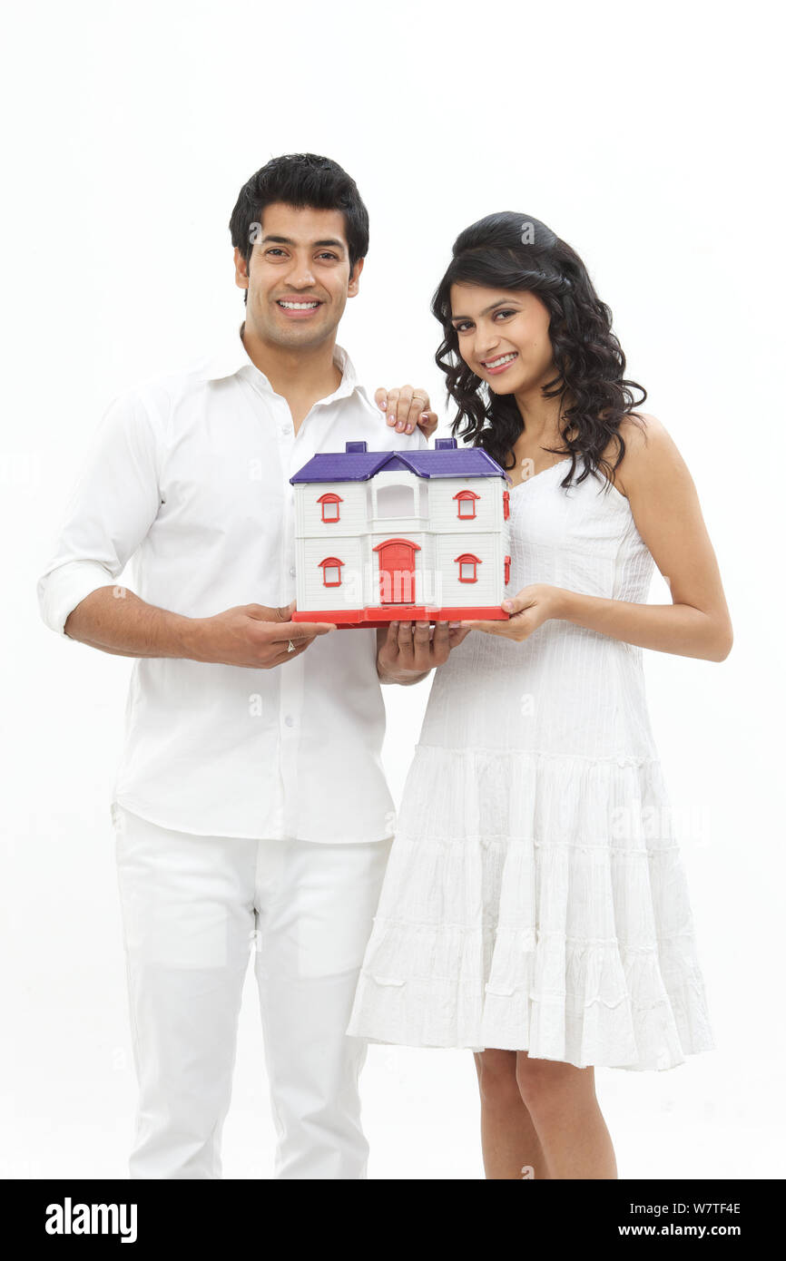 Young couple showing his dream home Stock Photo - Alamy