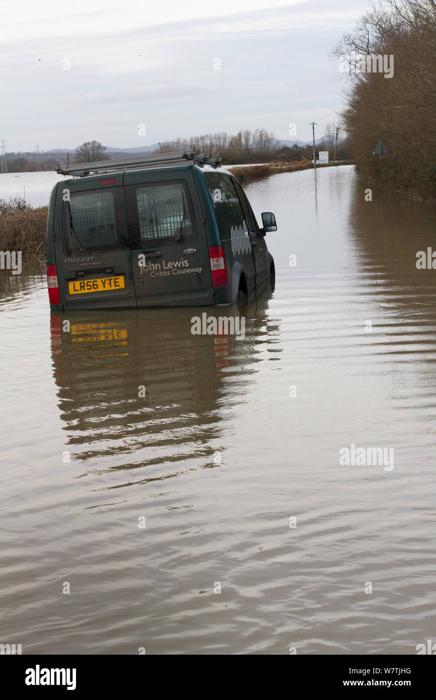 Abandoned van in flooded lane, during February 2014 flooding,  Severn valley, Gloucestershire, England, UK, 7th February 2014. Editorial use only. Stock Photo