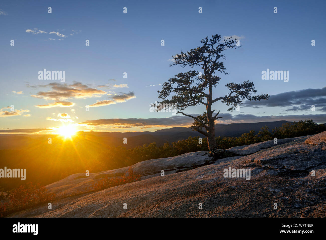 Sunset over the summit of Stone Mountain, Stone Mountain State Park. North Carolina, USA, October 2013. Stock Photo
