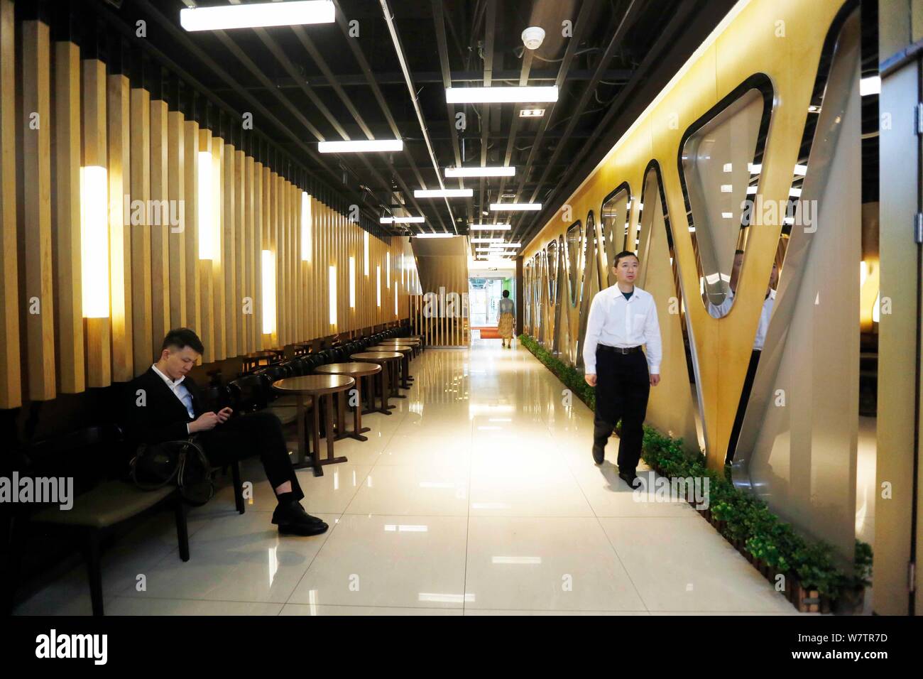 Customers are pictured at the Friendship Shopping Mall in Changning district, Shanghai, China