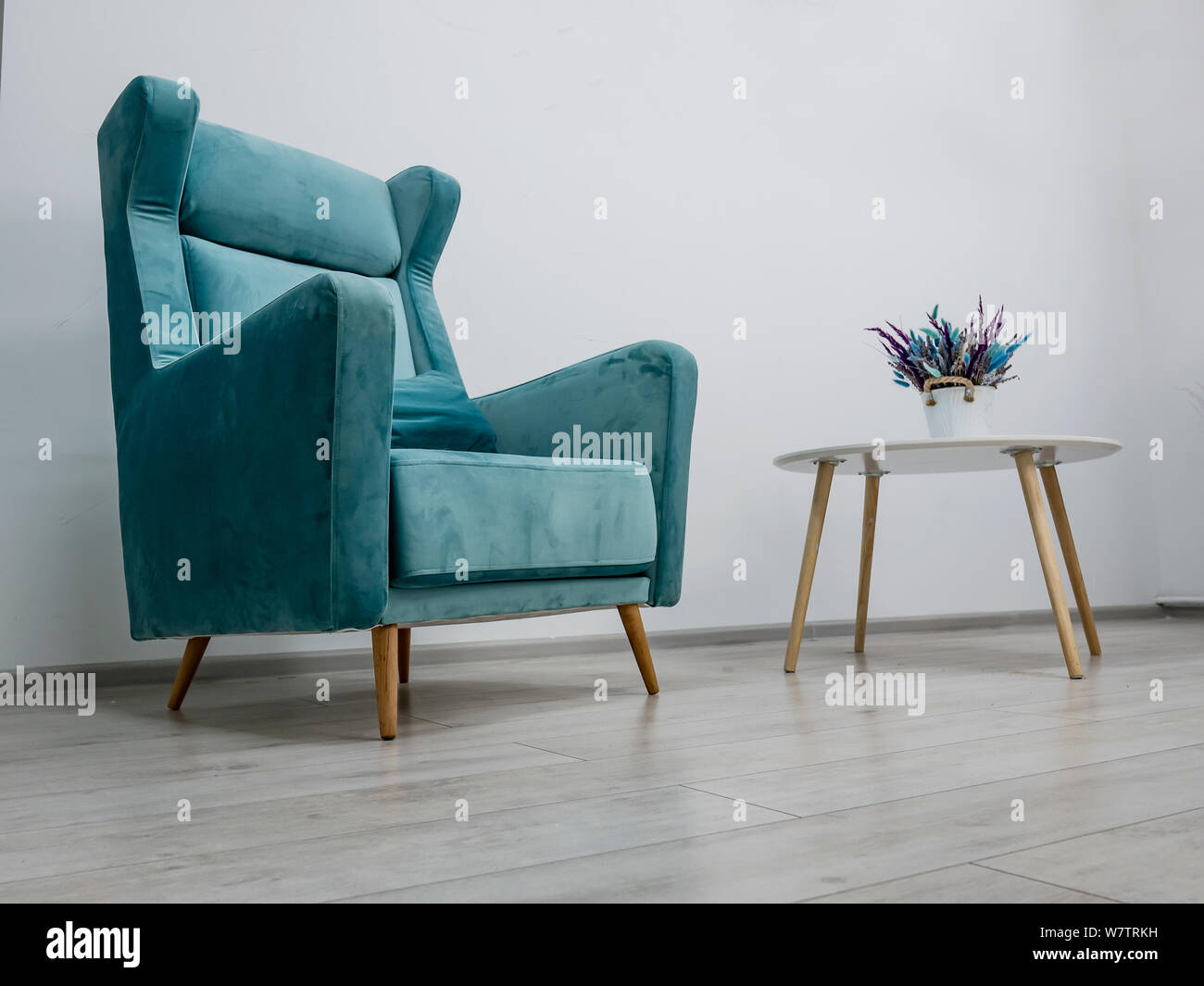 elegant green armchair and coffee table Stock Photo Alamy