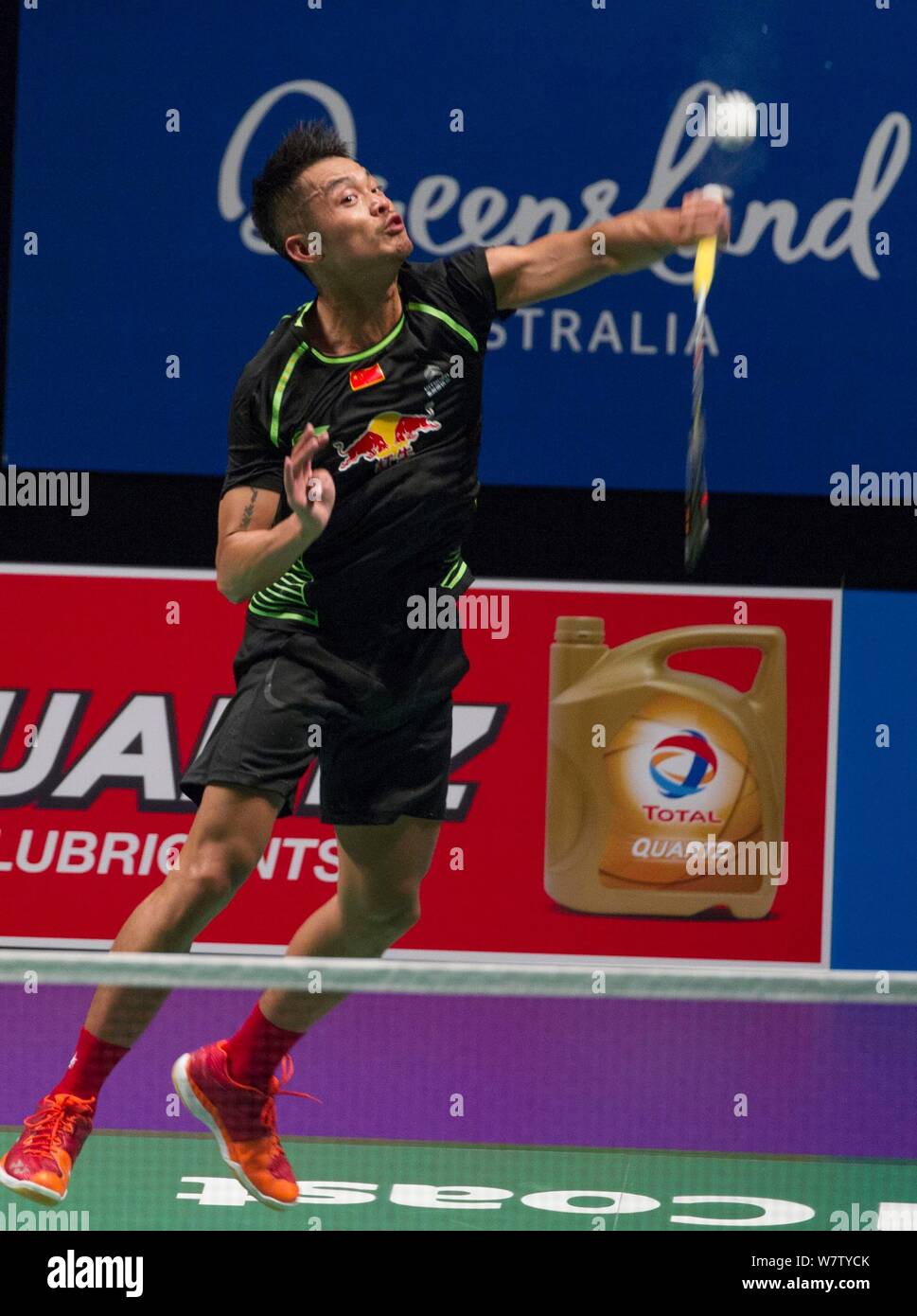 Lin Dan of China returns a shot to Kenta Nishimoto of Japan in their semifinal match of the men's singles during the 2017 Sudirman Cup BWF World Champ Stock Photo