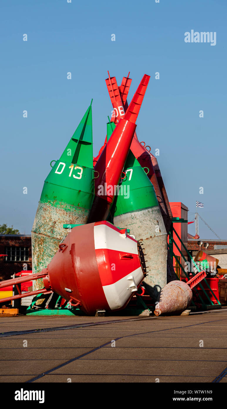 colorful buoys in norderney germany, ferry sign transportation Stock Photo