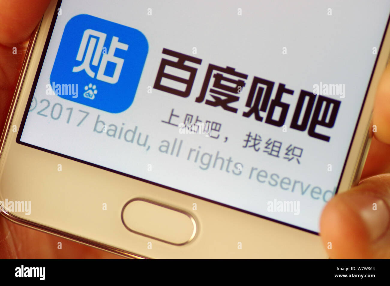 File A Chinese Mobile Phone User Looks At The Icon Of The Mobile