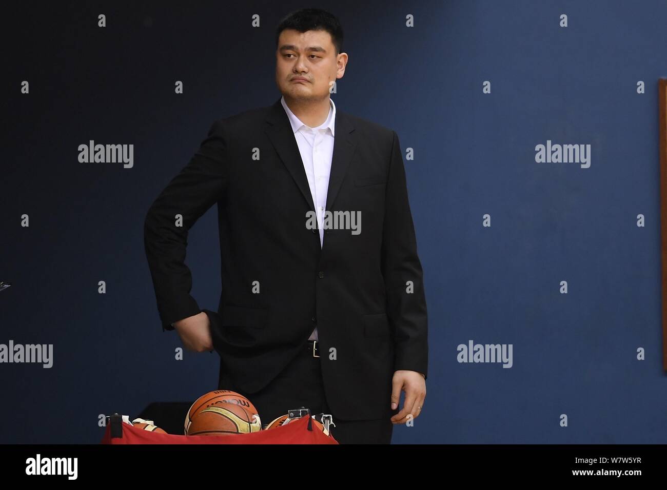 Retired Chinese basketball star Yao Ming, chairman of the Chinese Basketball Association (CBA), watches players of Chinese national women's basketball Stock Photo