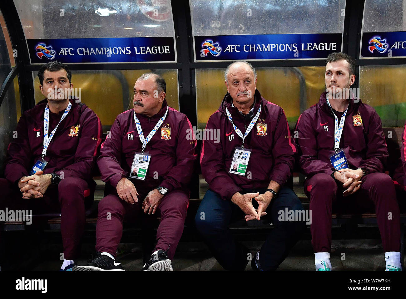 Head coach Luiz Felipe Scolari of China's Guangzhou Evergrande Taobao F.C., second right, watches his players competing against Hong Kong's Eastern SC Stock Photo