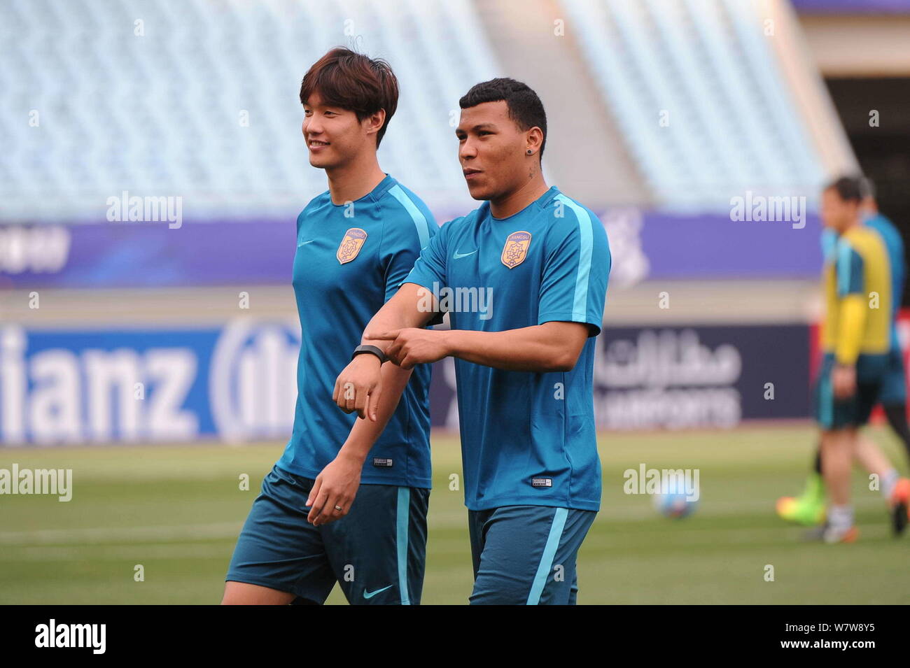 South Korean soccer player Hong Jeong-ho, left, and Colombian soccer player Roger Martinez, of China's Jiangsu Suning take part in a training session Stock Photo