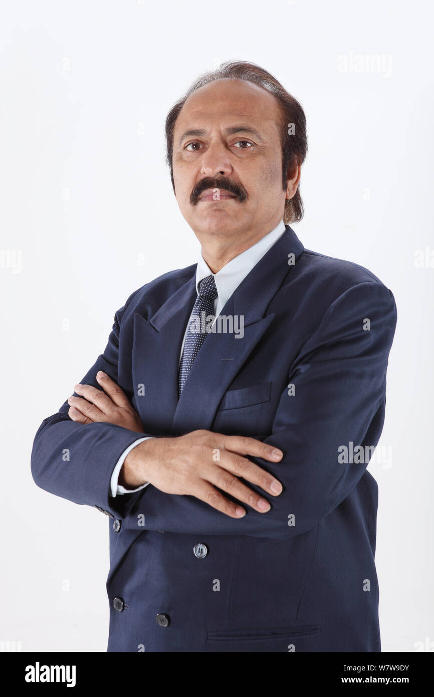 Portrait of a businessman with his arms crossed Stock Photo - Alamy