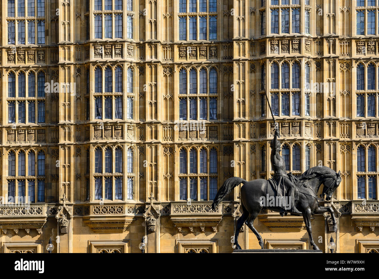 Side wall of The Palace of Westminster and Old Palace yard with the statue of Richard The Lionheart Stock Photo