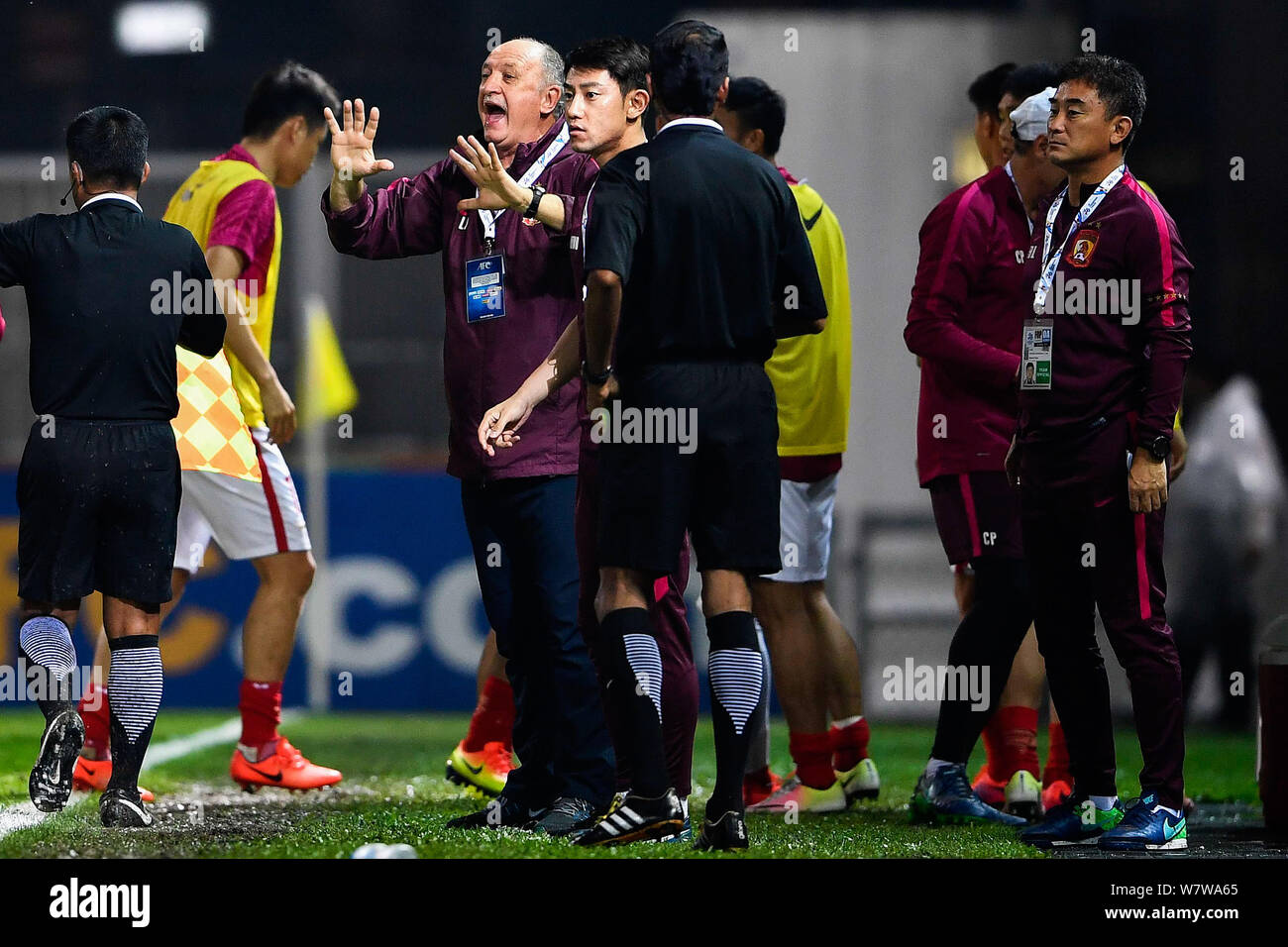 Head coach Luiz Felipe Scolari of China's Guangzhou Evergrande F.C. reacts as he watches his players competing against Hong Kong's Eastern SC in a Gro Stock Photo