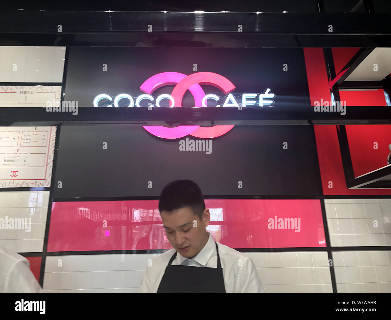 A waiter works at the Coco Chanel Cafe on West Nanjing Road in Shanghai,  China, 12 April 2017. Chanel is hosting a limited-time cafe in Shanghai, bu  Stock Photo - Alamy