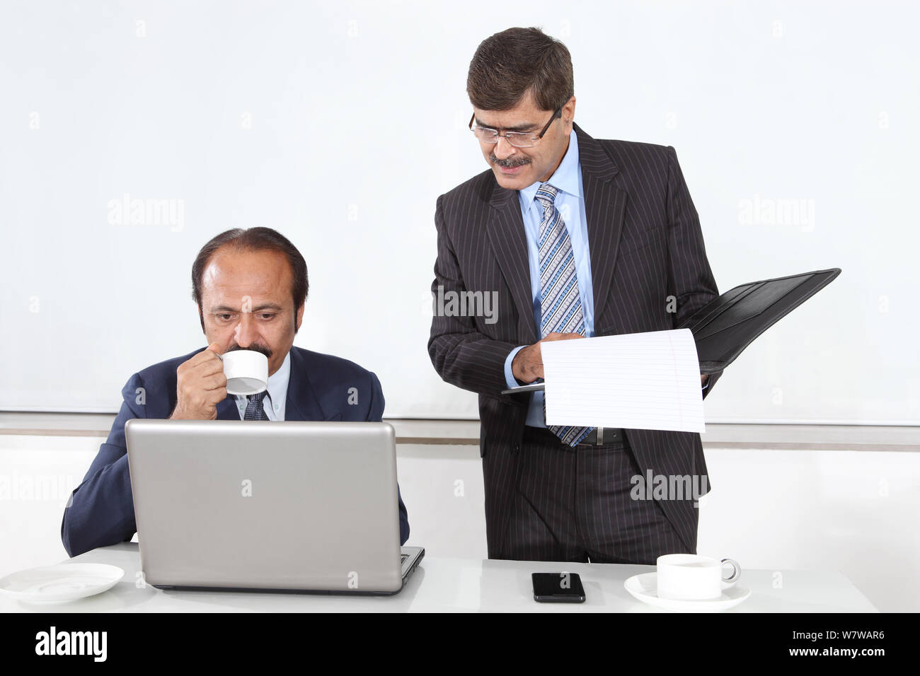 Two business executives working in an office Stock Photo - Alamy