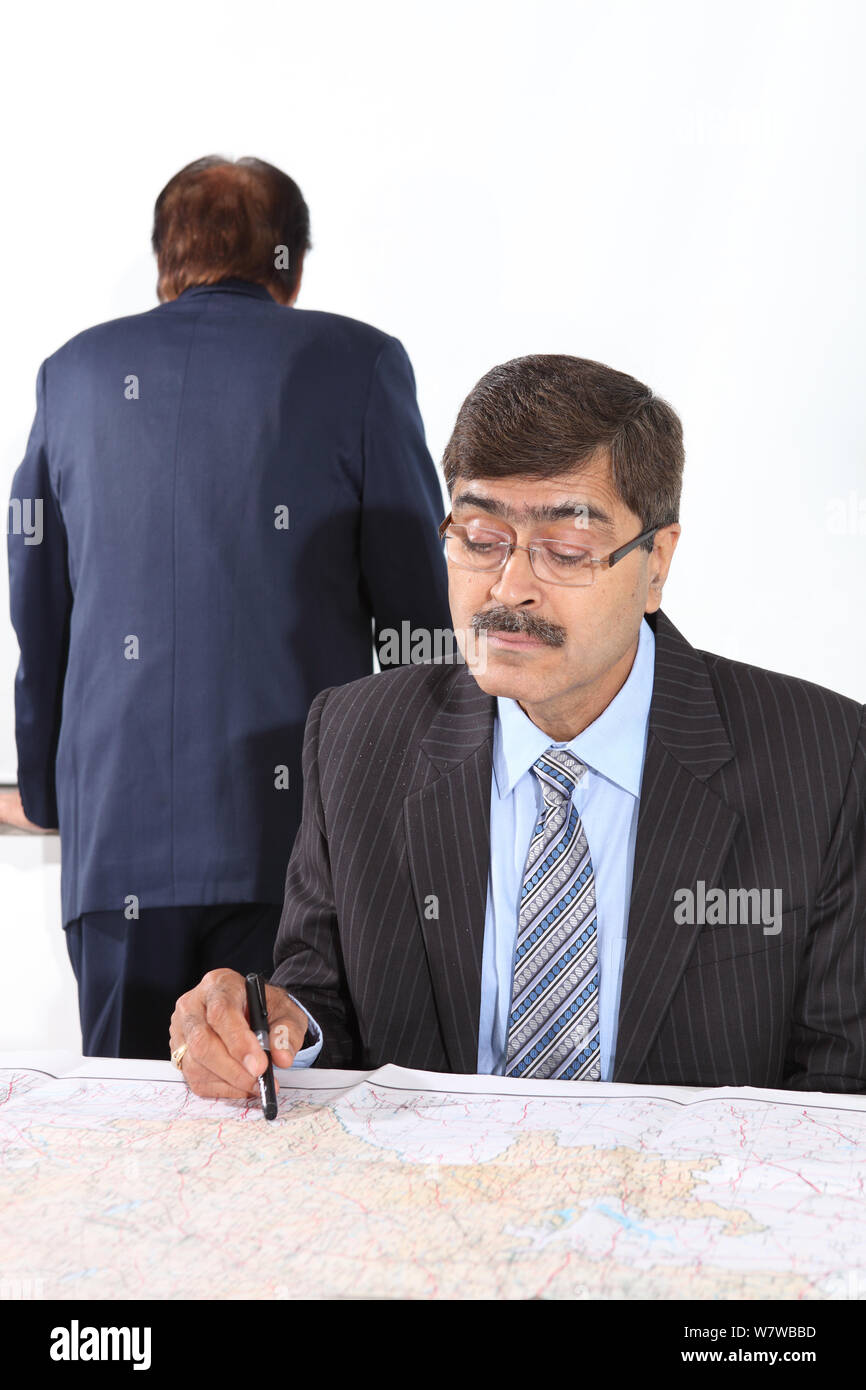 Businessman Looking In Map Stock Photo Alamy