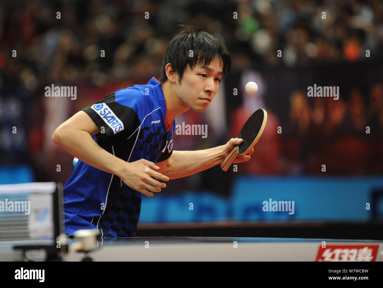 Koki Niwa of Japan returns a shot to Jeong Sangeun of South Korea in their men's singles semifinal match during the Seamaster 23rd ITTF - Asian Table Stock Photo