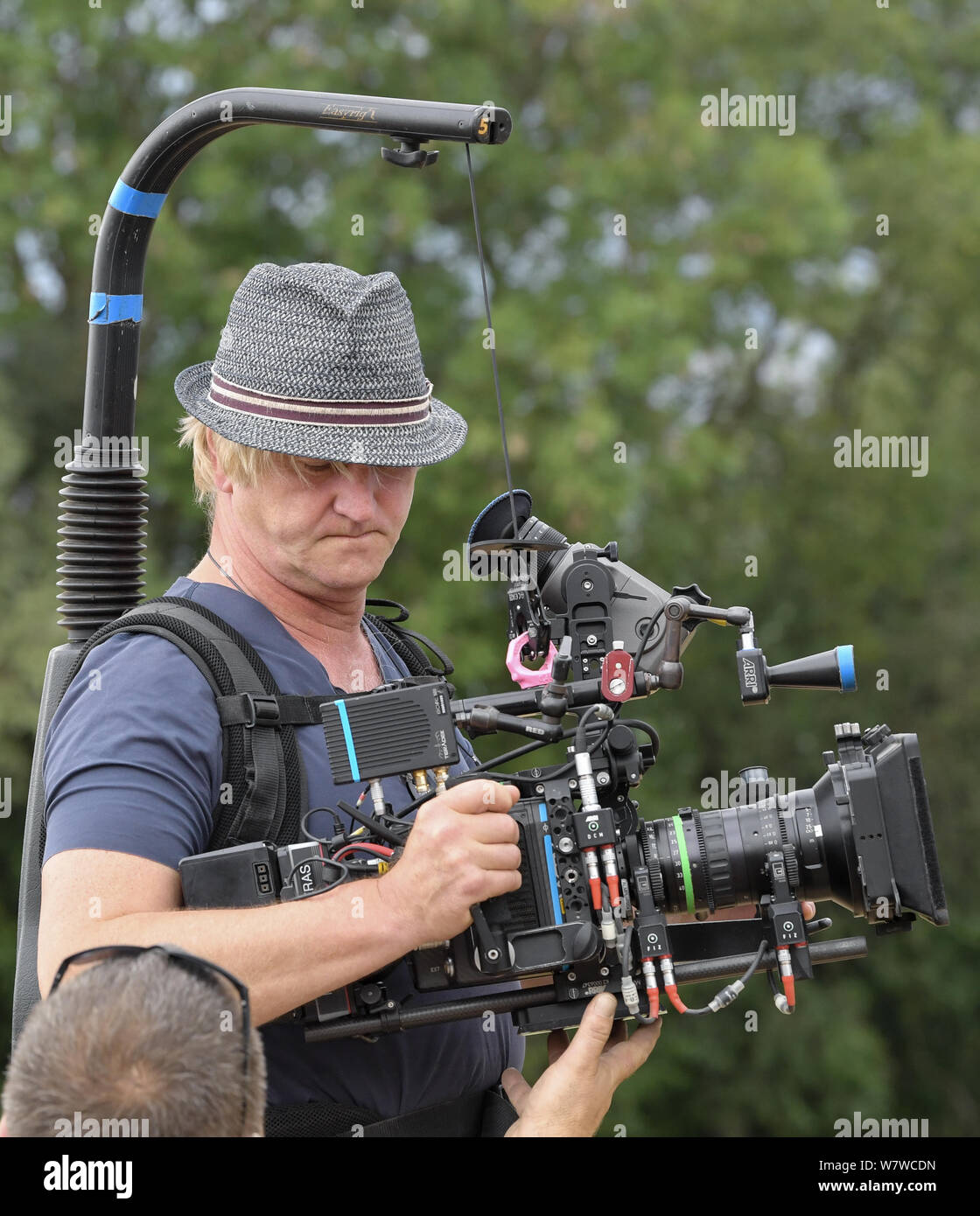 Reichenow, Germany. 06th Aug, 2019. Director Detlev Buck with a film camera  can be seen on the set of the Amazon series Bibi and Tina. The shooting of  the new Amazon Original
