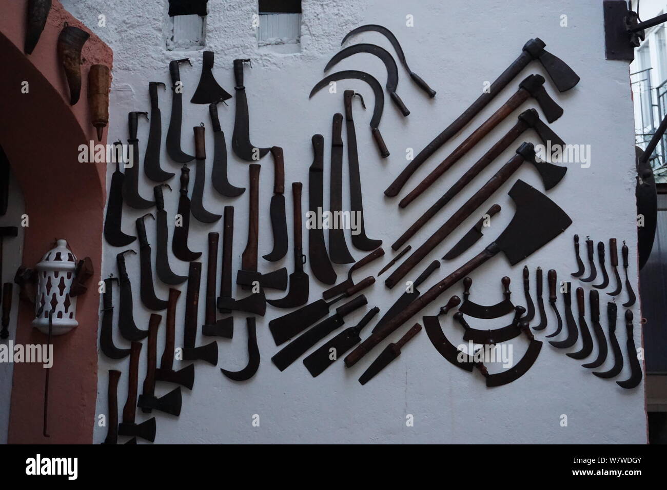 old metal tools diplayed on a white wall as a decoration Stock Photo