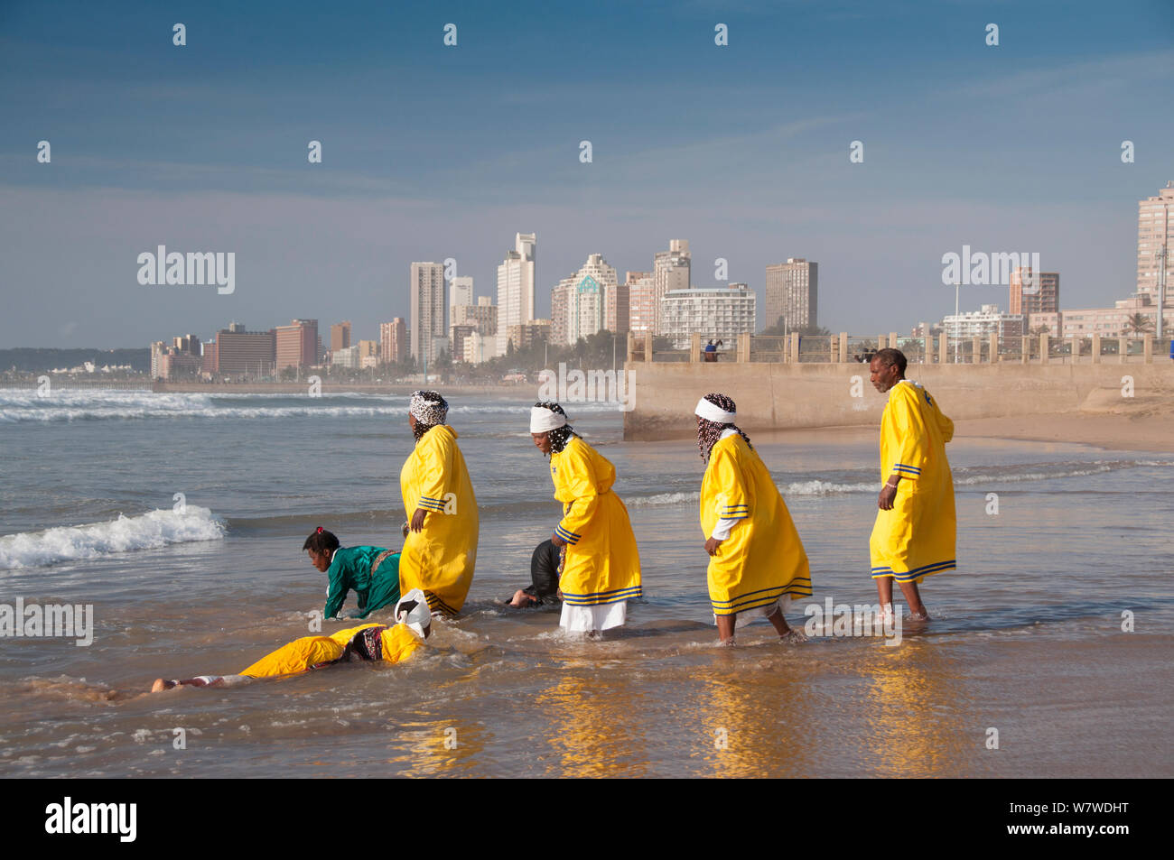 Traditional healers performing a baptism on Durban beach, KwaZulu-Natal, South Africa, August 2009. Stock Photo