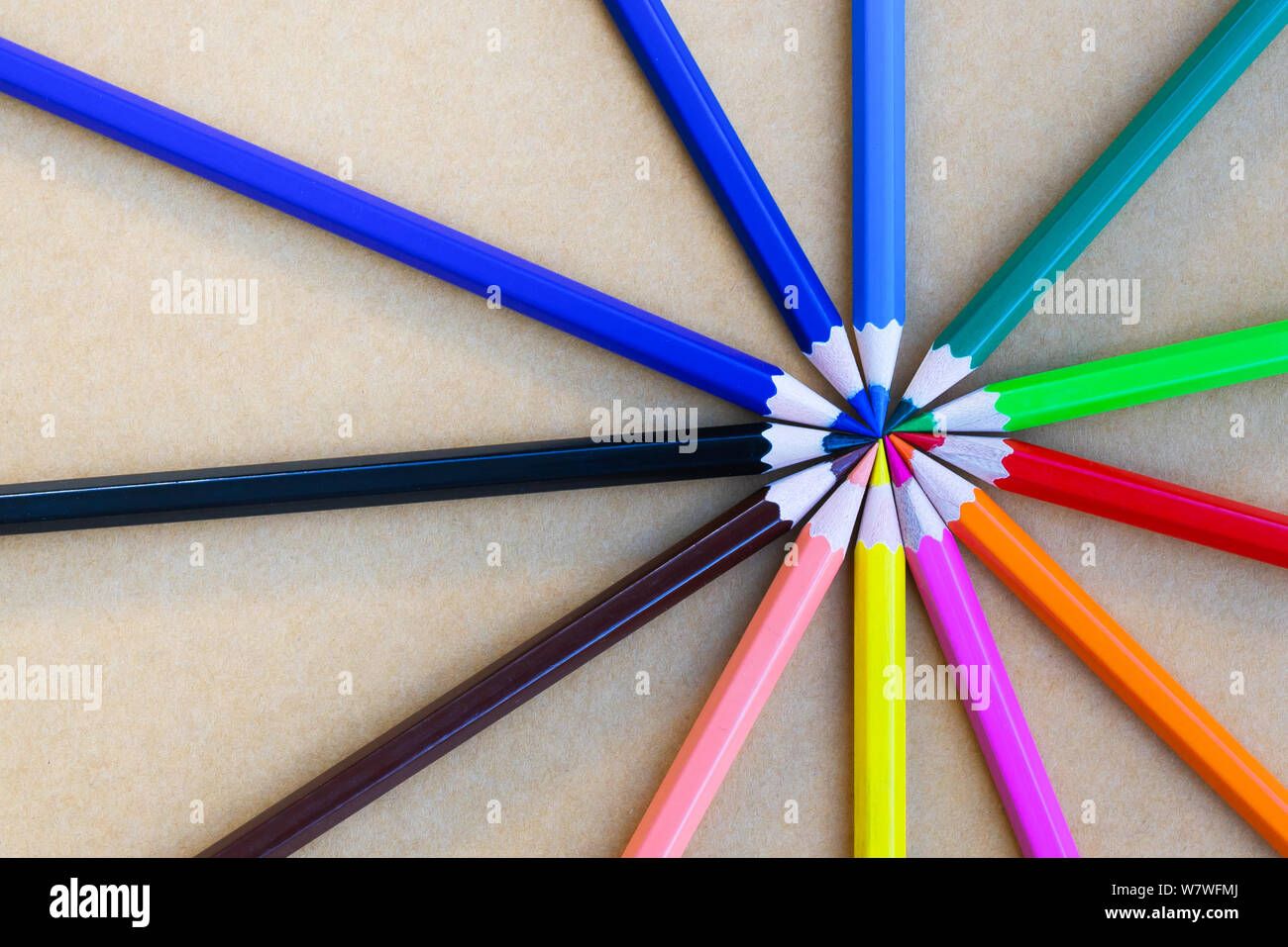 variety different color pencils on blue background Stock Photo