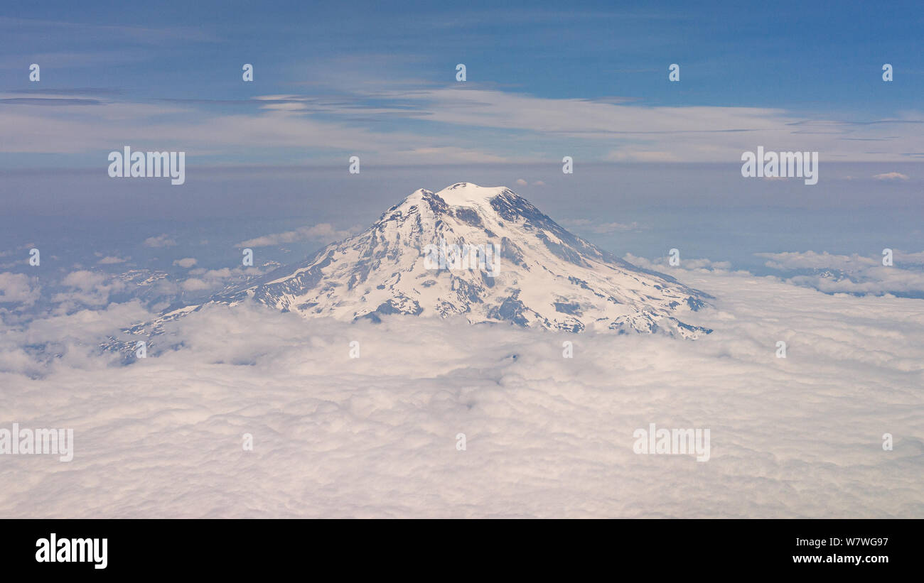 This is the picture of Mount Rainier with Clouds from Airplane View, Seattle, Washington. Stock Photo