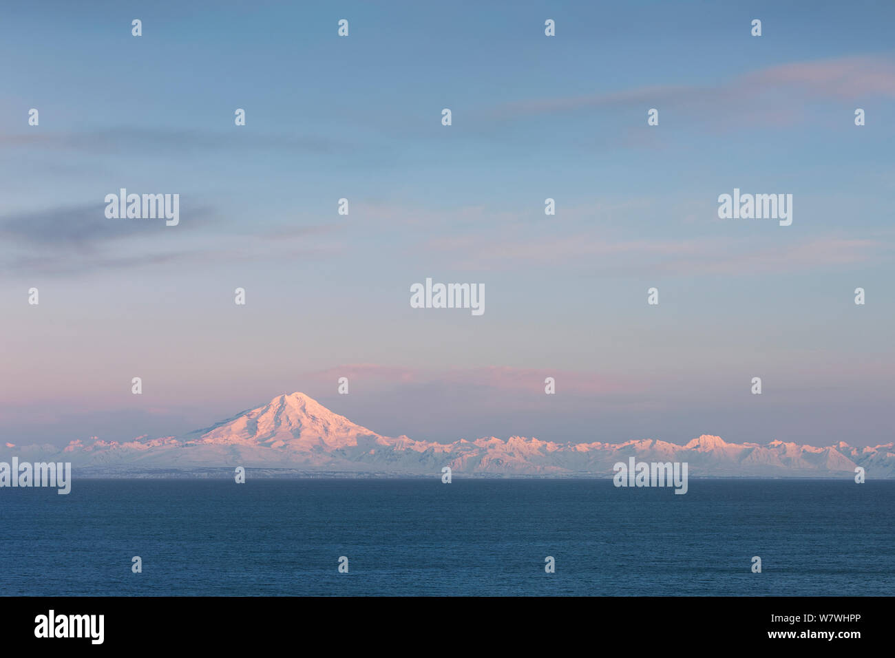 Mount Redoubt Volcano at sunrise, Lake Clark National Park, Cook Inlet, Alaska, USA, March 2013. Stock Photo