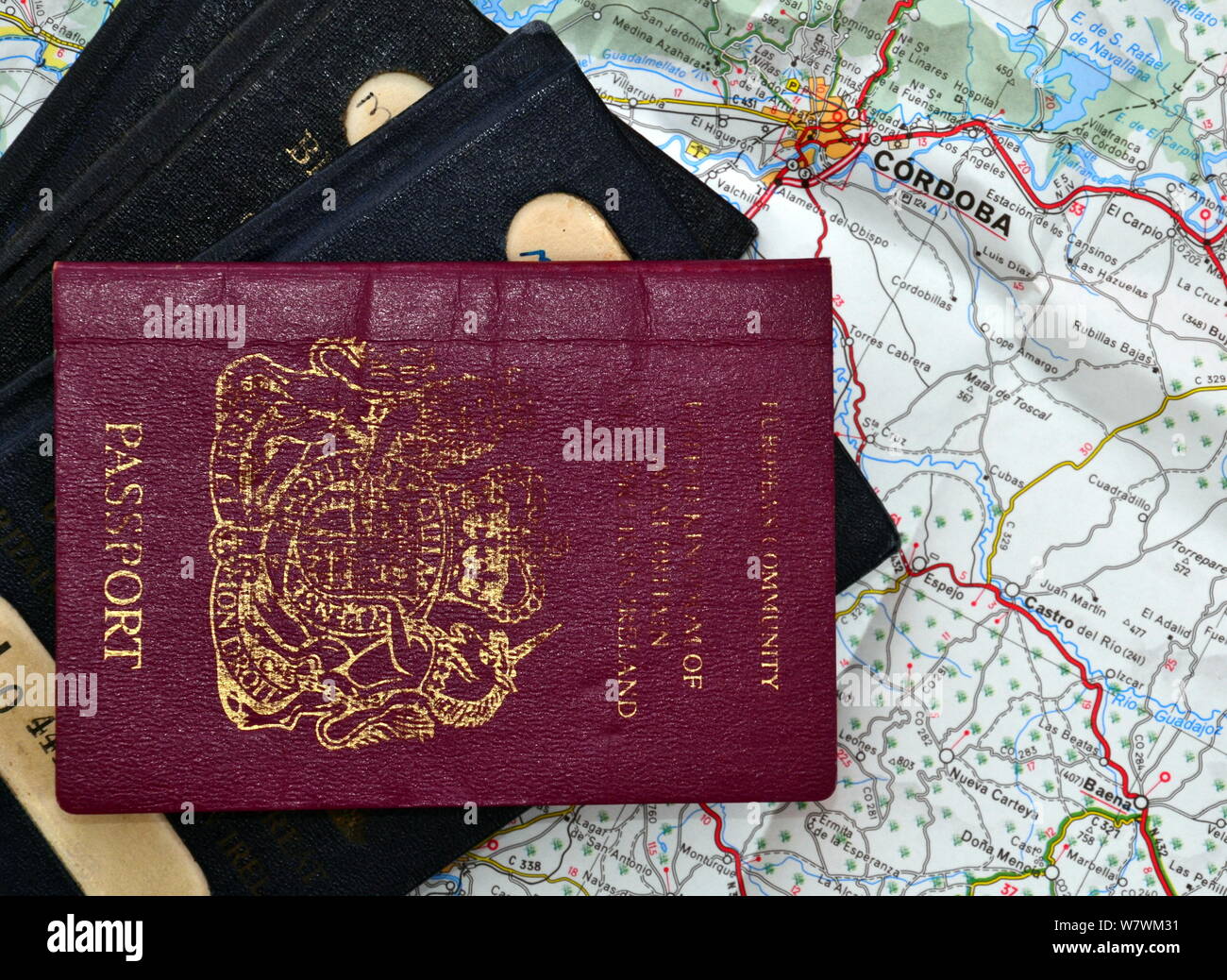 British passports on a map of part of Spain, including the city of Cordoba Stock Photo