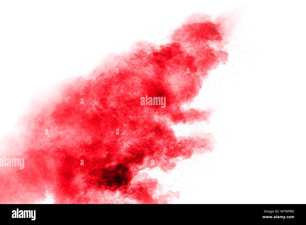 Abstract red dust splattered on white background. Red powder explosion ...