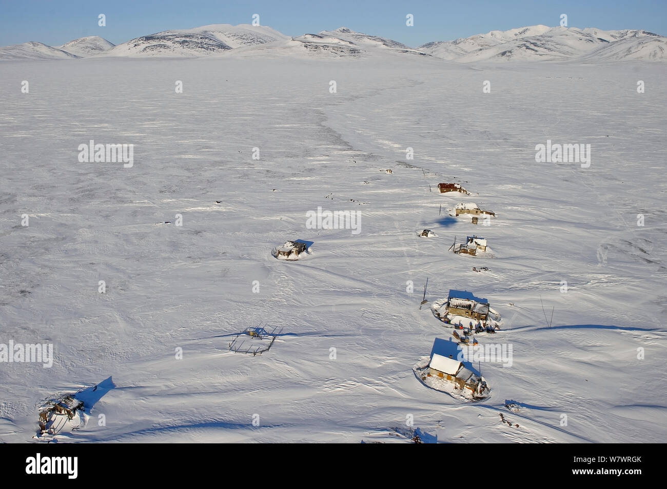 Snow covered houses on Wrangel Island, Far Eastern Russia, March 2011. Stock Photo