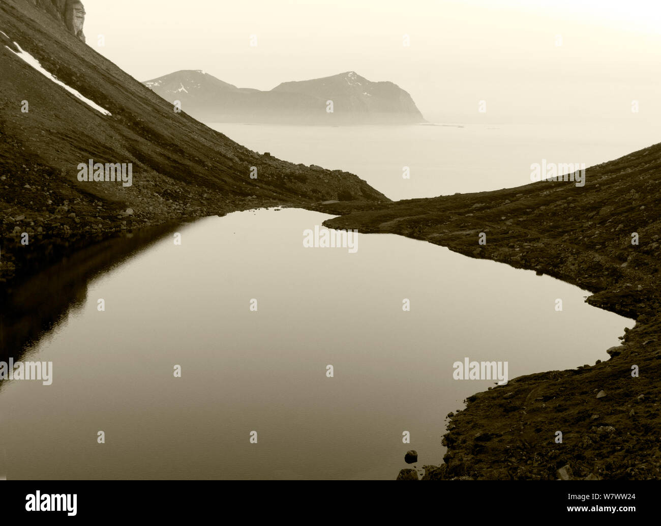 Misty landscape of fjords, Flakstadoy, Lofoten, Norway, June. Stock Photo