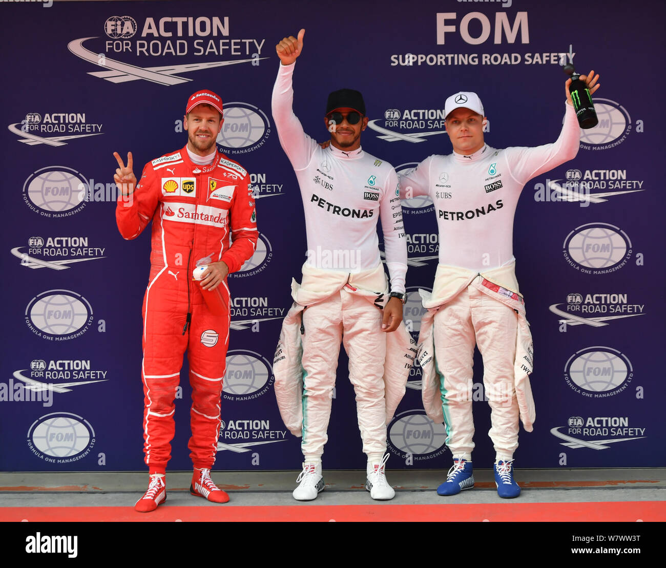 British F1 driver Lewis Hamilton of Mercedes, center, German F1 Sebastian  Vettel of Ferrari, left, and Finnish F1 driver Valtteri Bottas of Mercedes  w Stock Photo - Alamy