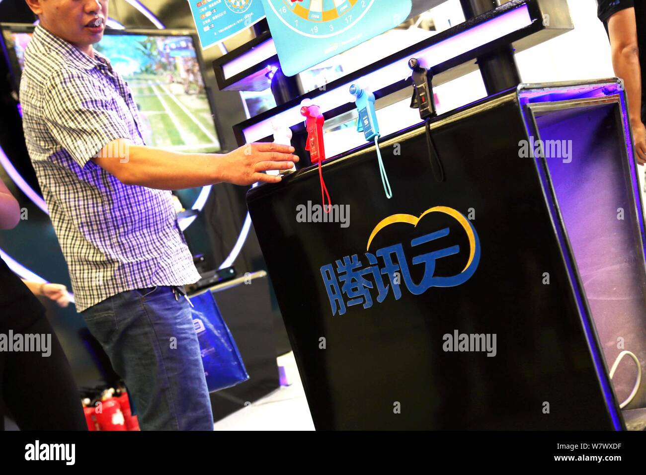 --FILE--People visit the stand of qcloud, the online cloud computing unit of Tencent, during the 13th China Digital Entertainment Expo, also known as Stock Photo