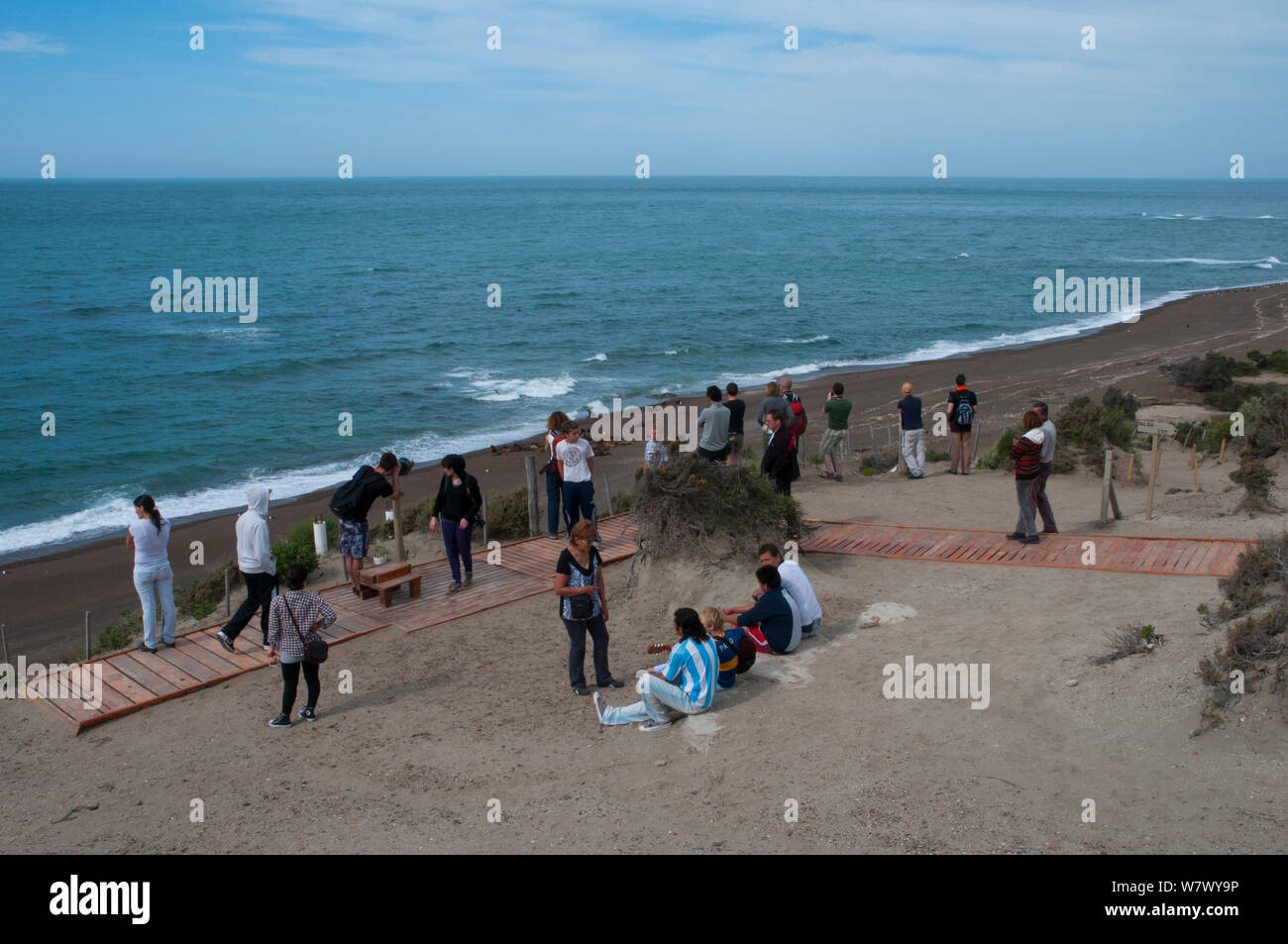 Tourists watching orcas from the beach, Punta Norte Nature Reserve, Valdes Peninsula, Chubut, Patagonia, Argentina. Stock Photo