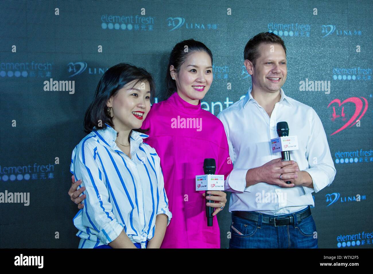 Retired Chinese tennis star Li Na, center, attends the opening ceremony of the restaurant co-opened by her and restaurant brand 'Element Fresh' in Wuh Stock Photo