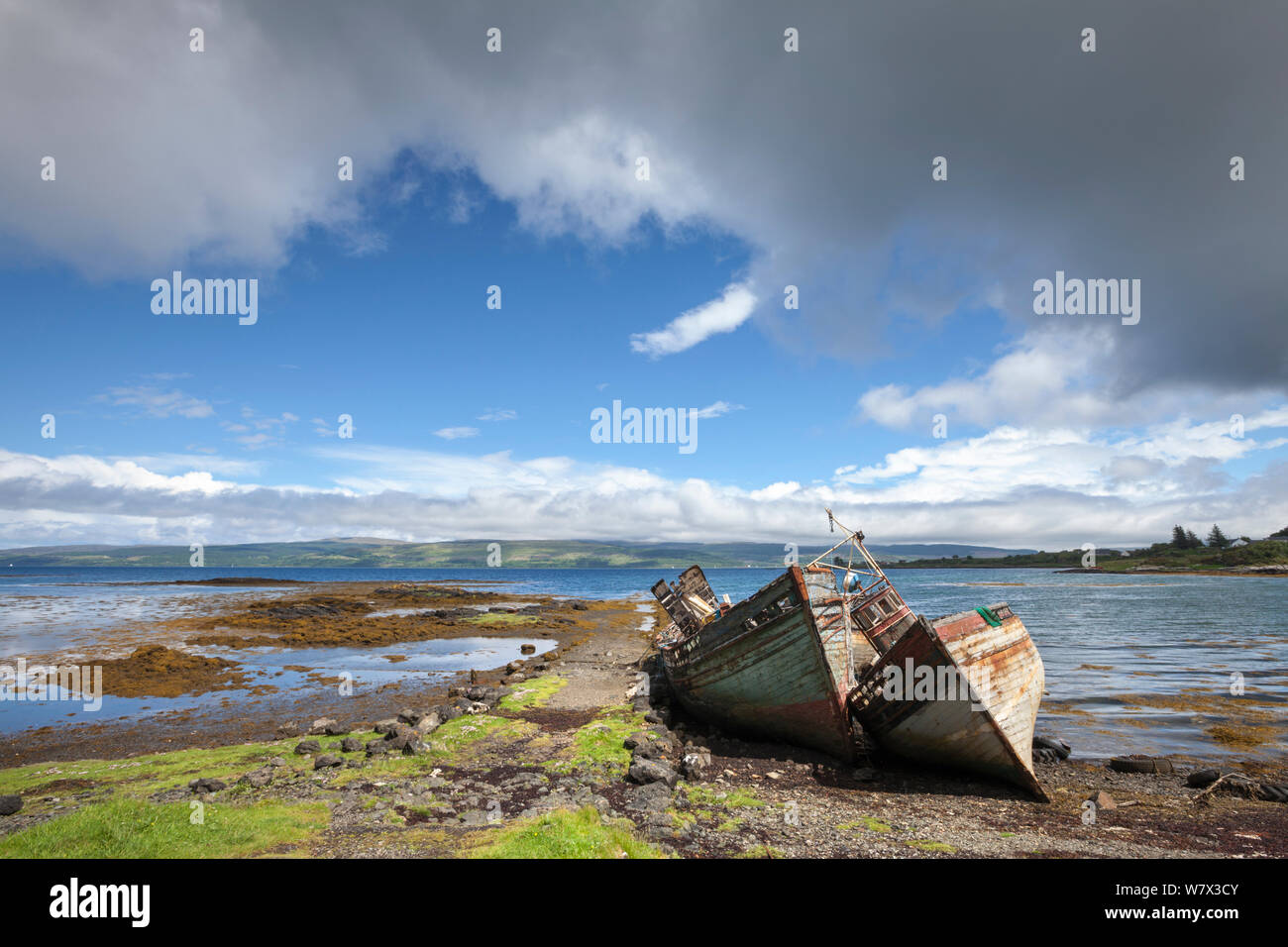 Abandoned fishing boats on beach, Salen, Isle of Mull, Scotland, UK. June 2013. Stock Photo