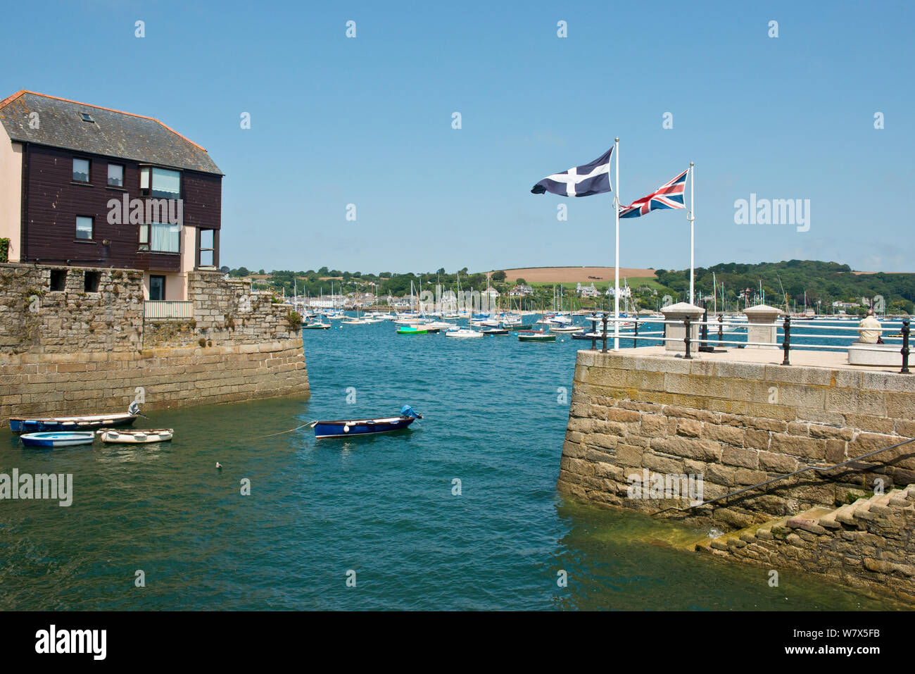 Cornish Saint Pirans and British Union Jack flags on pier at Falmouth. Cornwall, England Stock Photo