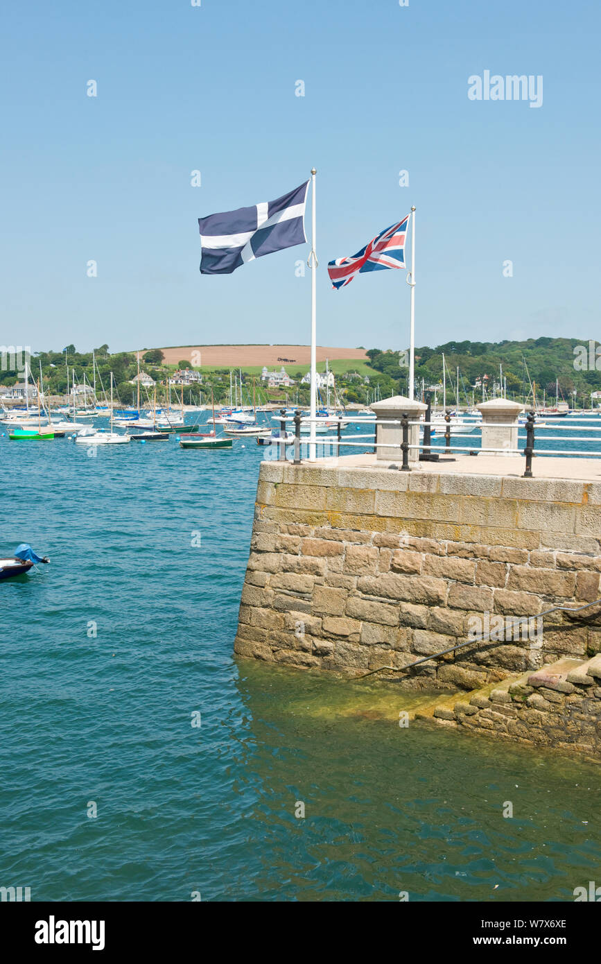 Cornish Saint Pirans and British Union Jack flags on pier at Falmouth. Cornwall, England Stock Photo