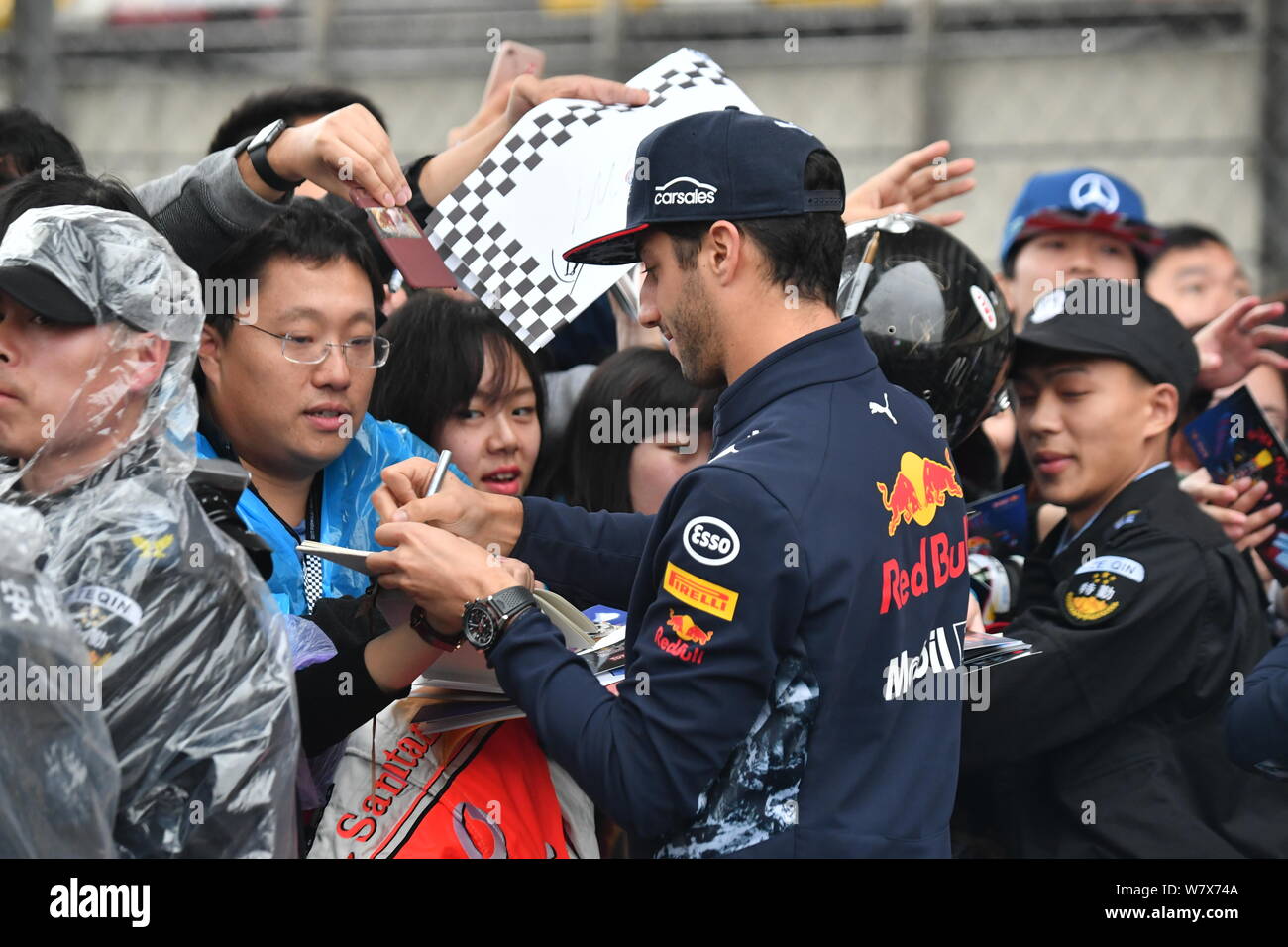 Australian F1 driver Daniel Ricciardo of Red Bull Racing signs autographs  for fans during a fan meeting event before the 2017 Formula One Chinese  Gran Stock Photo - Alamy
