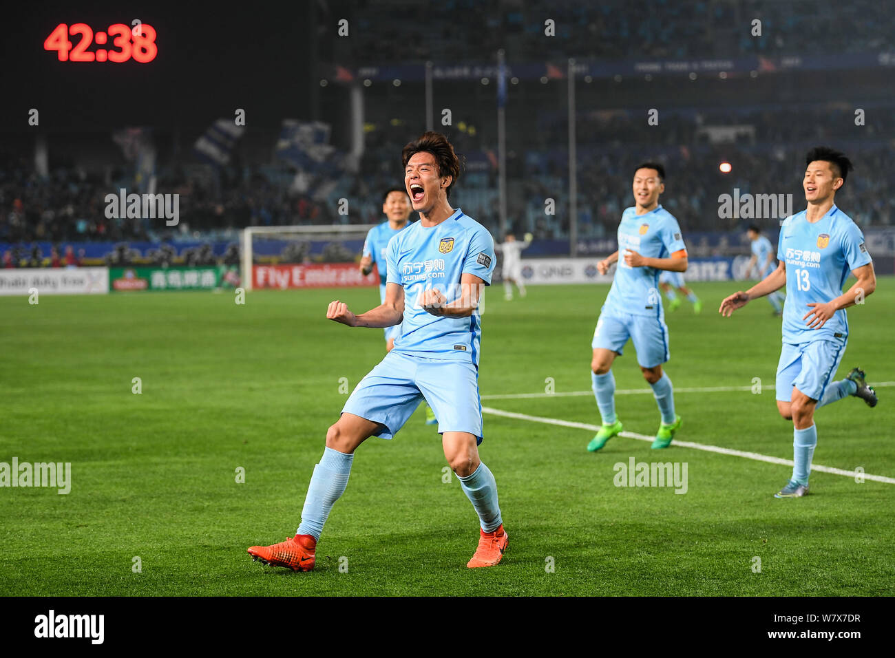 Hong Jeong-ho of China's Jiangsu Suning celebrates after scoring a goal against Japan's Gamba Osaka in their Group H match during the AFC Champions Le Stock Photo