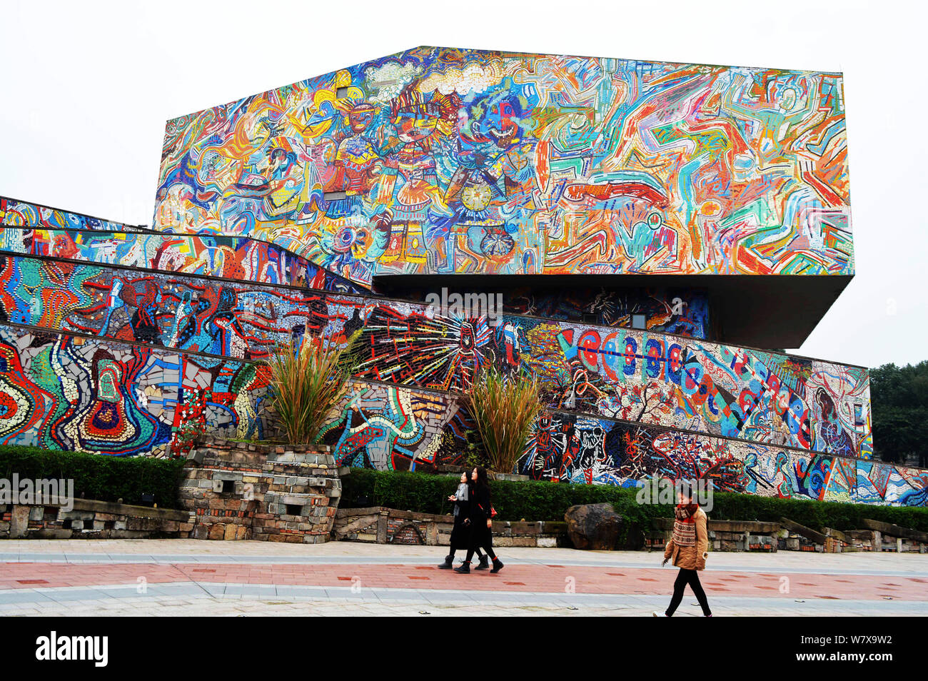 Visitors walk past the Luo Zhongli Art Museum at Sichuan Fine Arts ...
