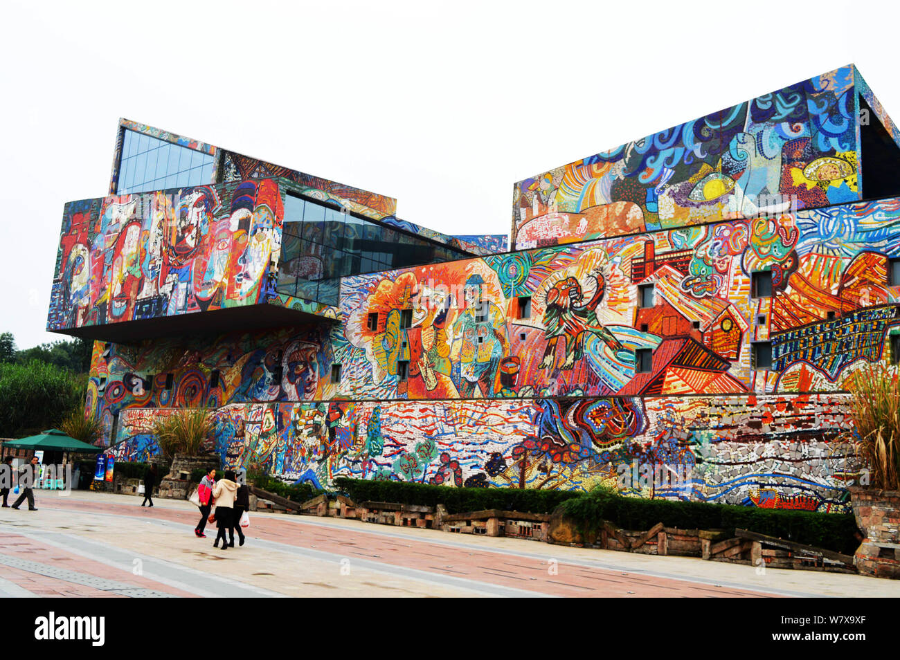 Visitors walk past the Luo Zhongli Art Museum at Sichuan Fine Arts ...