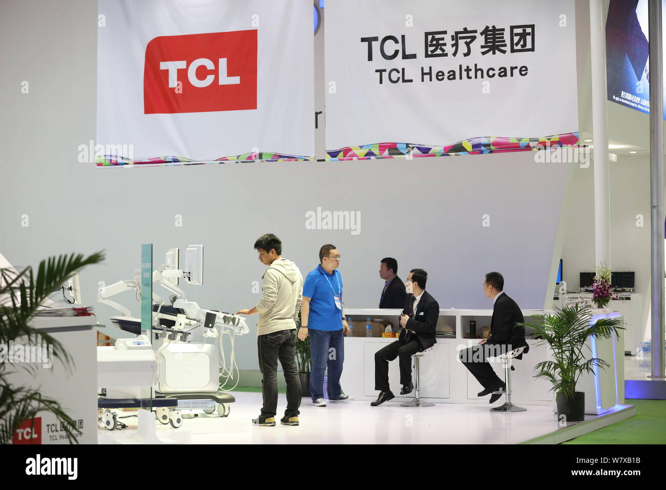 --FILE--People visit the stand of TCL during an exhibition in Shanghai, China, 20 April 2017.   TCL Corp Chairman Li Dongsheng said the Chinese electr Stock Photo